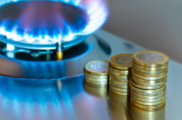 Une gazinire allume et des pices de monnaie.