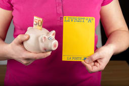 Paris, France - 9 janvier 2020 : Livret A, carnet d'&eacute;pargne 'Laposte' dans la main d'une personne