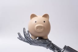 Main robotique futuriste tenant une tirelire, symbolisant l'intelligence artificielle dans la finance, les &eacute;conomies intelligentes, la banque num&eacute;rique, la technologie d'investissement et les solutions de gestion d'argent automatis&eacute;es.