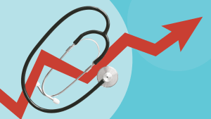 Stéthoscope sur un graphique financier en hausse.