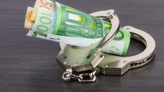 Menottes et billets