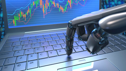 Une main robotique passe un ordre en bourse