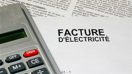Un document facture d'lectricit avec une calculatrice.