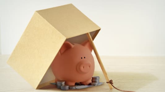 Une tirelire prise au piège.