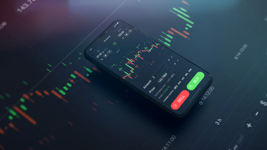 Reprsentation de a bourse sur un tlphone portable, avec un graphique.