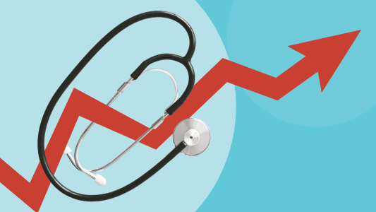 St&eacute;thoscope sur un graphique financier en hausse.