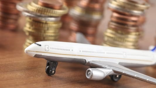 Un avion et des pices d'euro